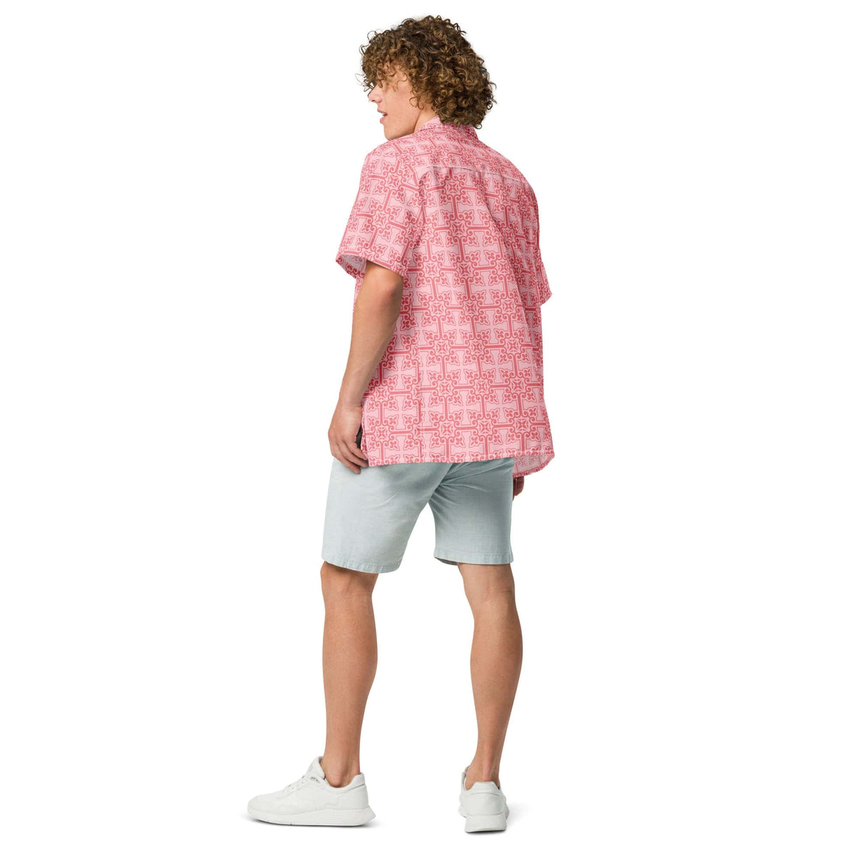 Pink patterned button-up shirt from back view, short sleeves.