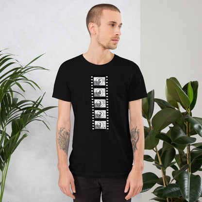 Black short-sleeve t-shirt with vertical film countdown strip graphic at chest, crewneck.