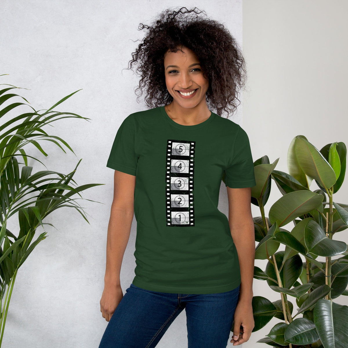 Forest green short-sleeve t-shirt with vertical film countdown strip graphic, crewneck.