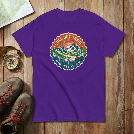 Purple hiking t-shirt with round vintage trail badge graphic on the chest