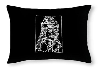 Black throw pillow with white rectangular woodcut graphic of a crowned figure