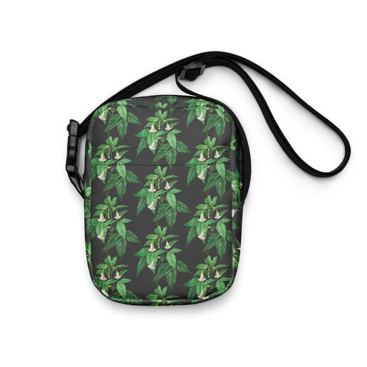 Utility crossbody bag with green leaf floral print and black strap, front pocket