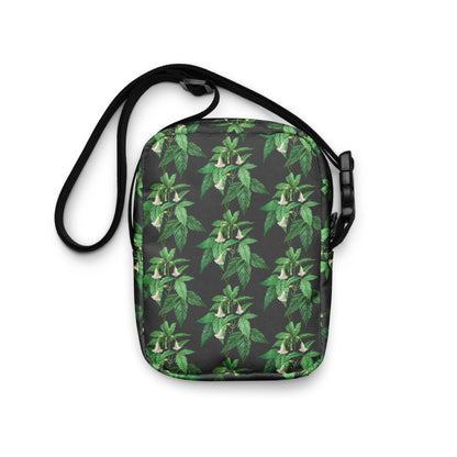 Utility crossbody bag with green leaf floral print, loop handle and black shoulder strap
