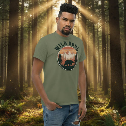 Model wearing green bear camping graphic t-shirt with circular Wild Soul logo