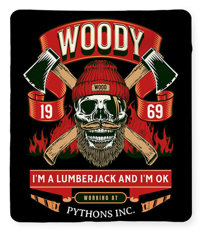 Black-backed printed blanket with red ribbon reading 'Working at' and skull face